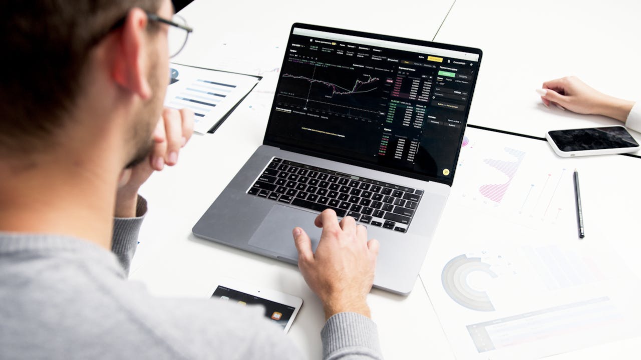 Man staring at his laptop figuring out the 6 pillars of data quality